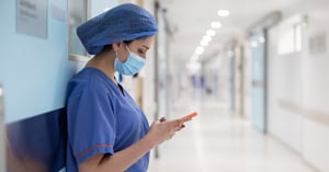 surgeon-texting-outside-the-operating-room