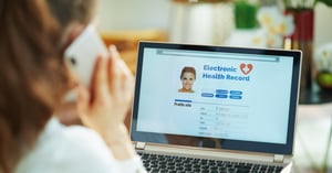 woman-at-home-checking-her-medical-record_soc