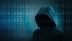 young-hacker-with-hood-and-binary-code